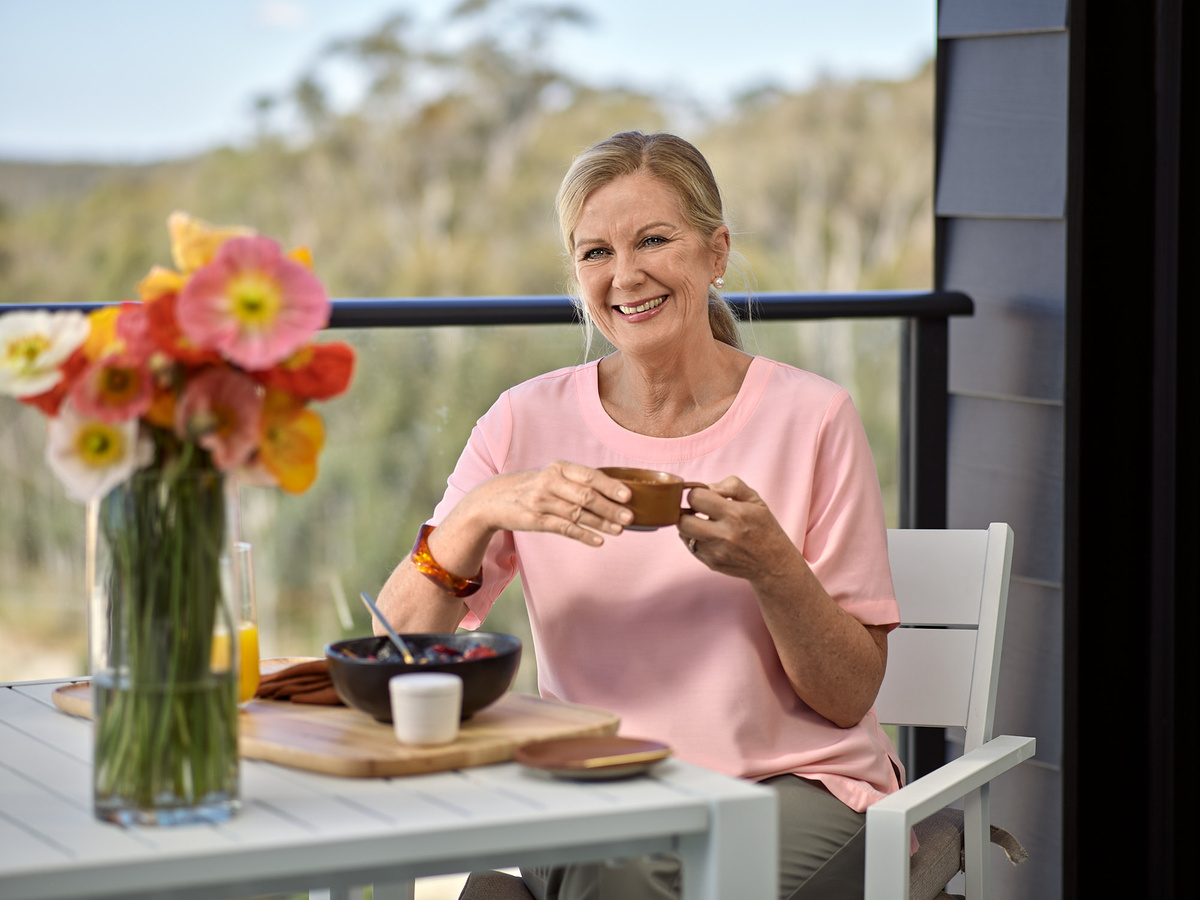 Happy woman drinking a coffee