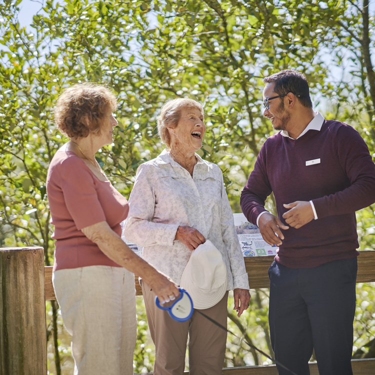 Village manager chatting with residents at Lakeside
