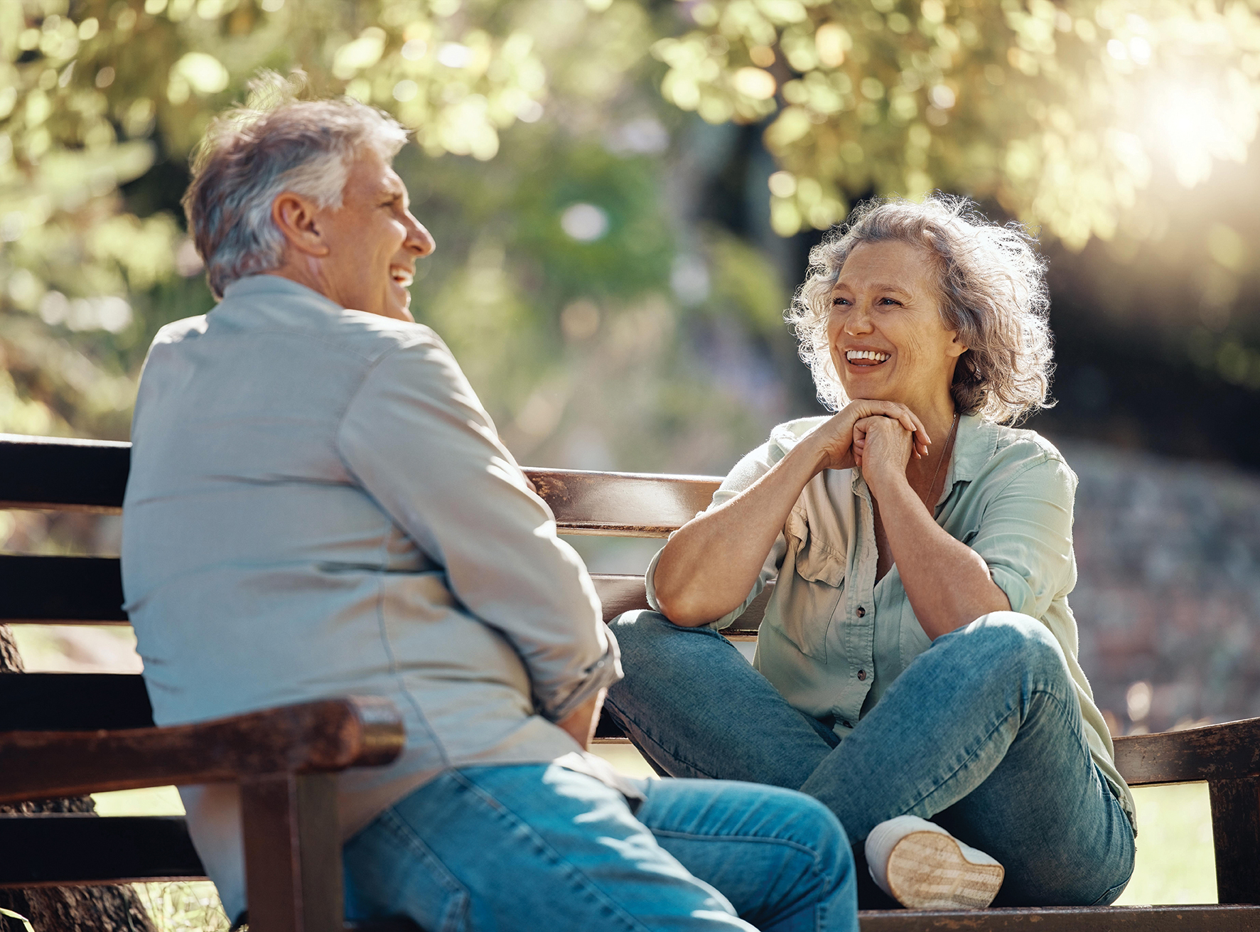 a couple sitting on a bench and relaxing