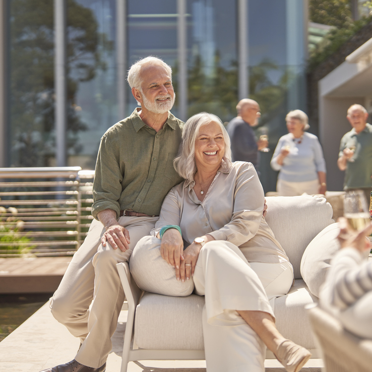 Couple sitting on terrace at The Baytree
