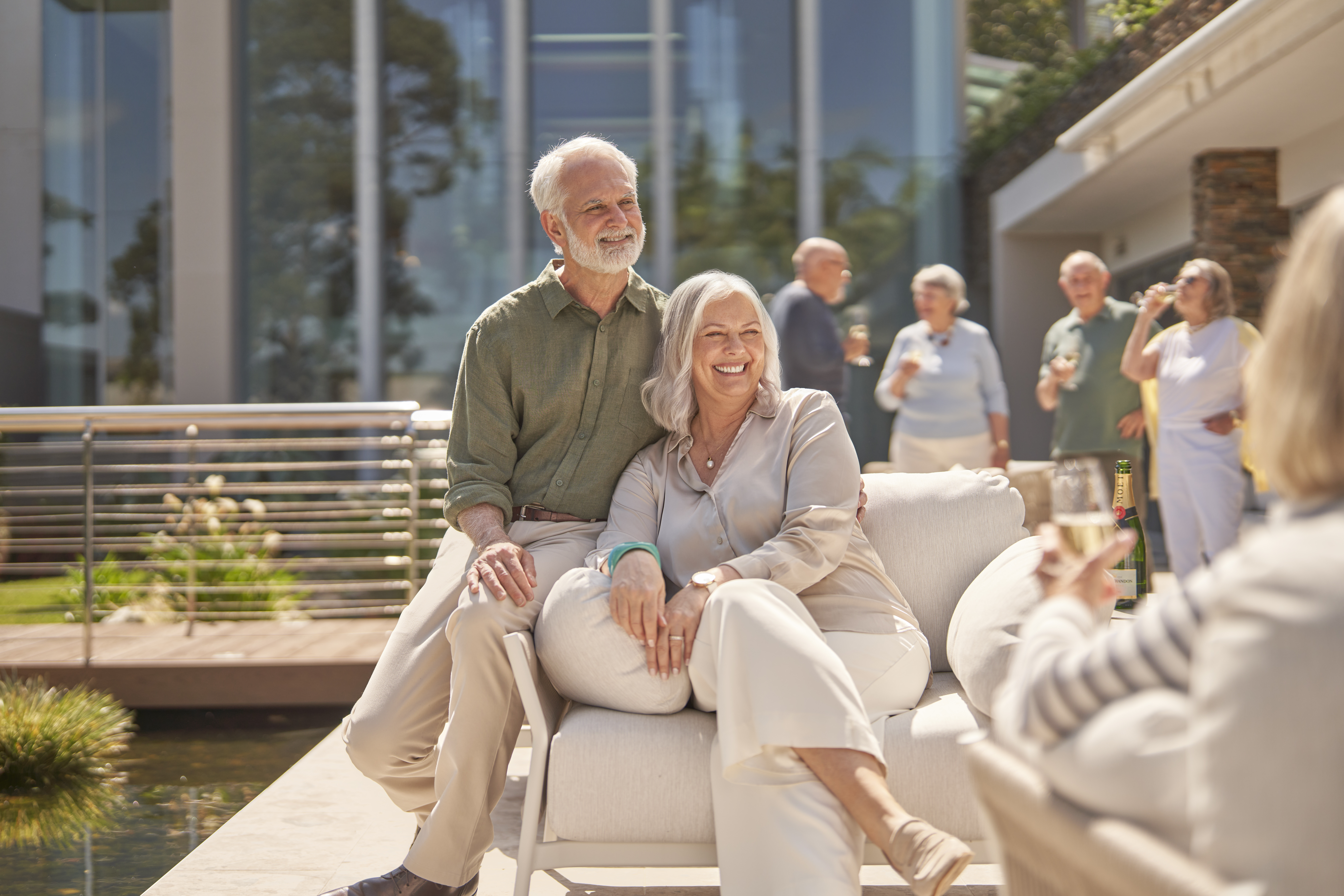 Couple sitting on couch at The Baytree
