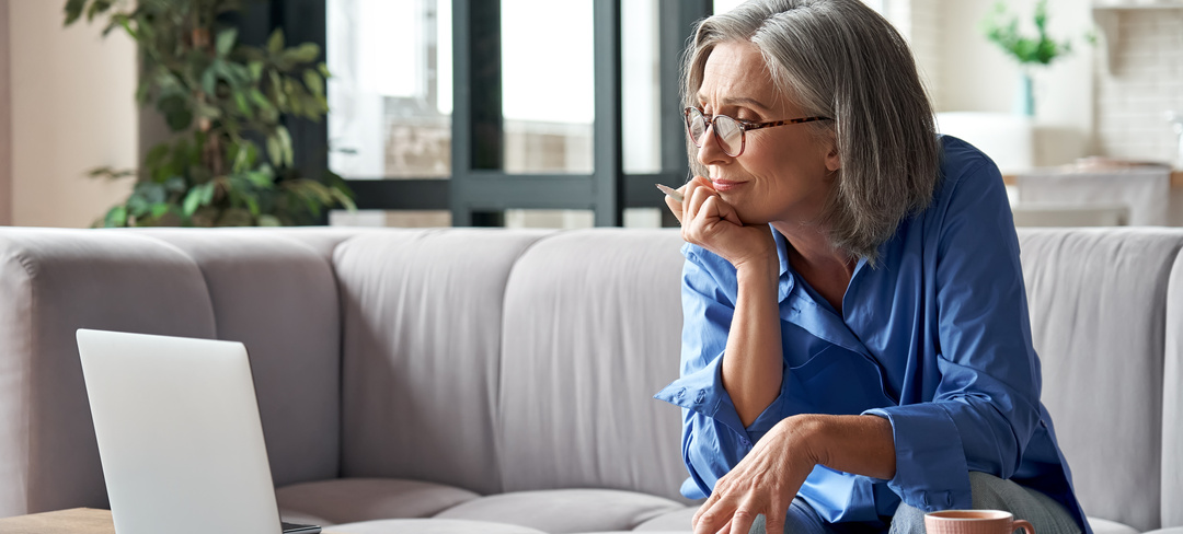 Senior mature older woman watching business training, online webinar on laptop computer remote working or social distance learning from home. 60s businesswoman video conference calling in virtual chat