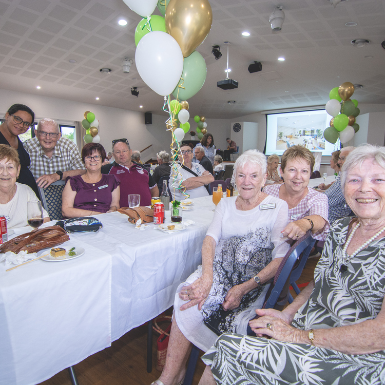 Residents of The Gardens on Lindfield  seated together at the community centre reopening event.
