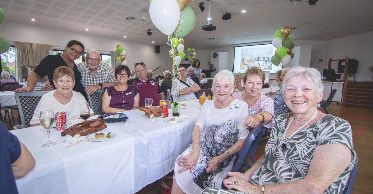 Residents of The Gardens on Lindfield  seated together at the community centre reopening event.