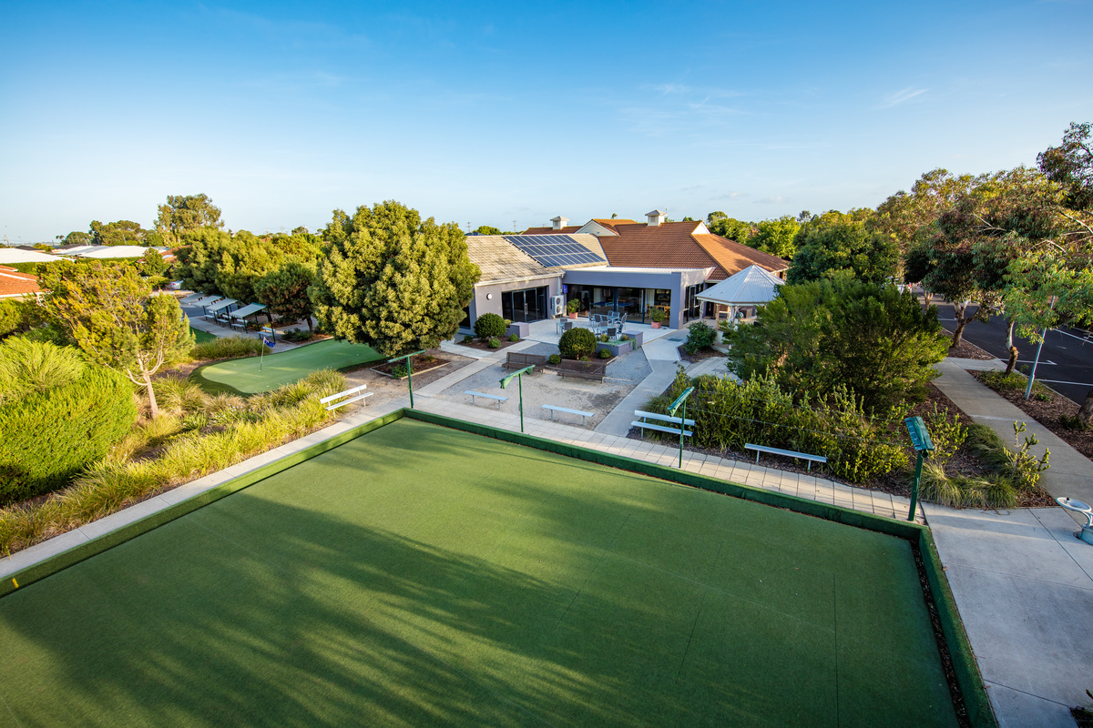 Windsor Park aerial image of bowling green with shade and seating located next to gardens and main building
