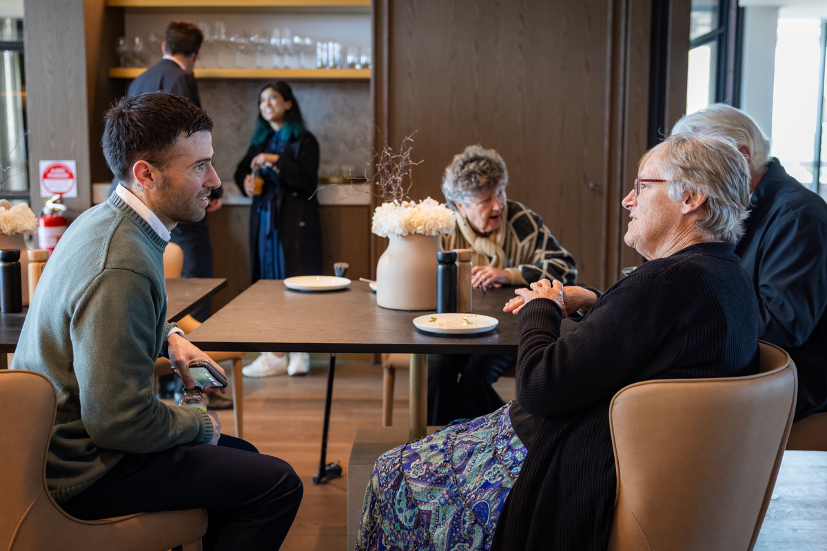 Ardency Kennedy Place residents Lee talking to James Massei