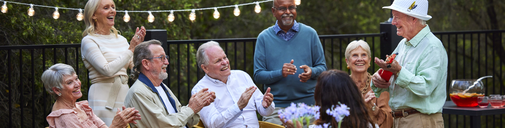 A hand under fresh running water in the sunlight