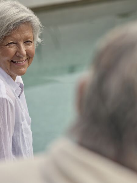 Woman relaxing by the pool