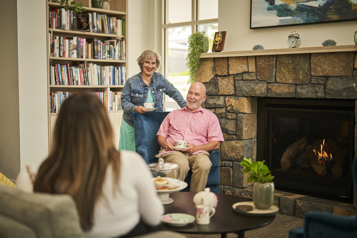 The Aerie at Narrabundah - Residents in the village community clubhouse near the fireplace