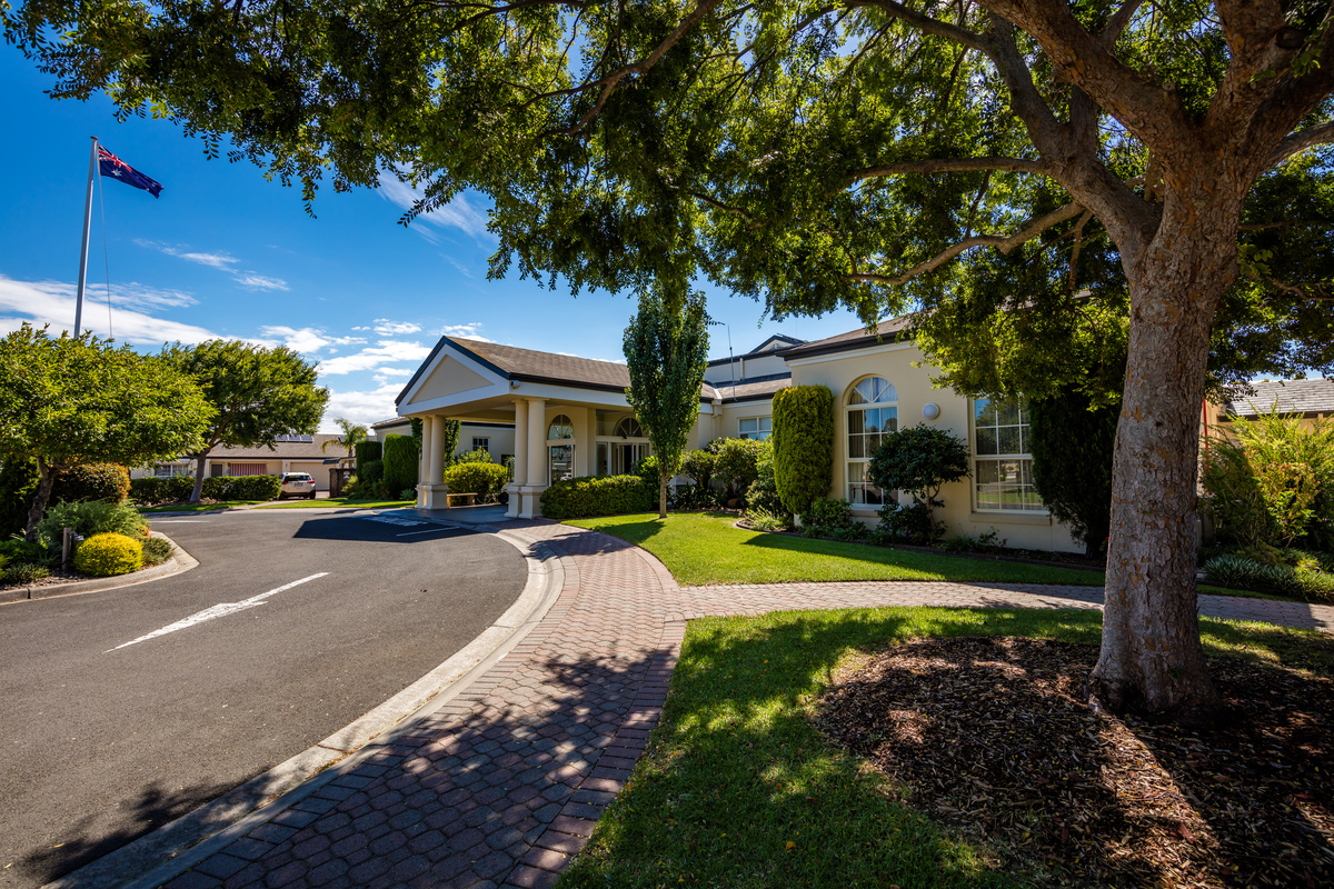 Port Phillip Village street view over landscaping looking towards main entrance