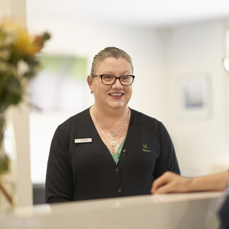 A staff member talking to a resident
