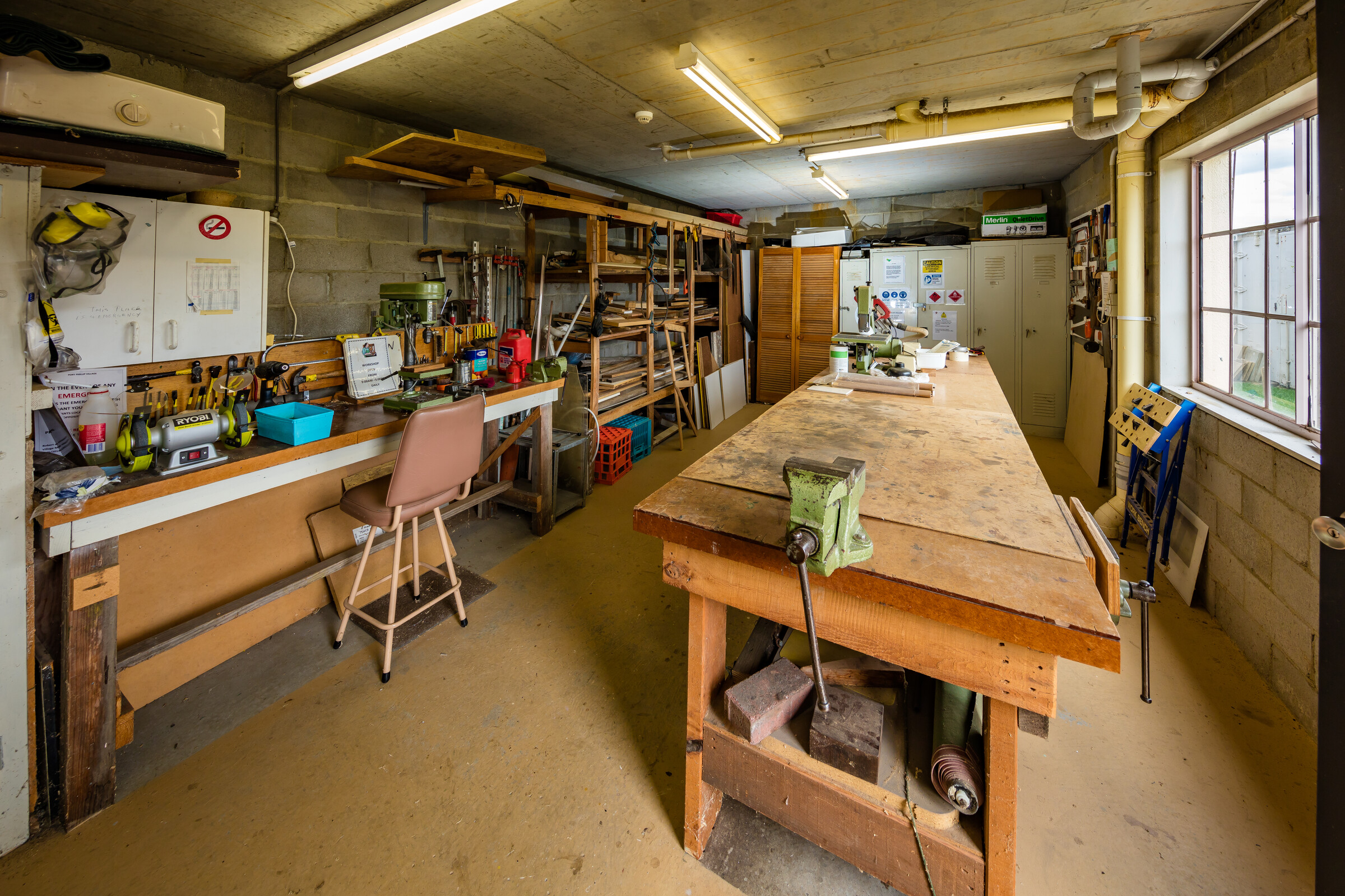 Port Phillip Village workshop with stocked machinery and tools