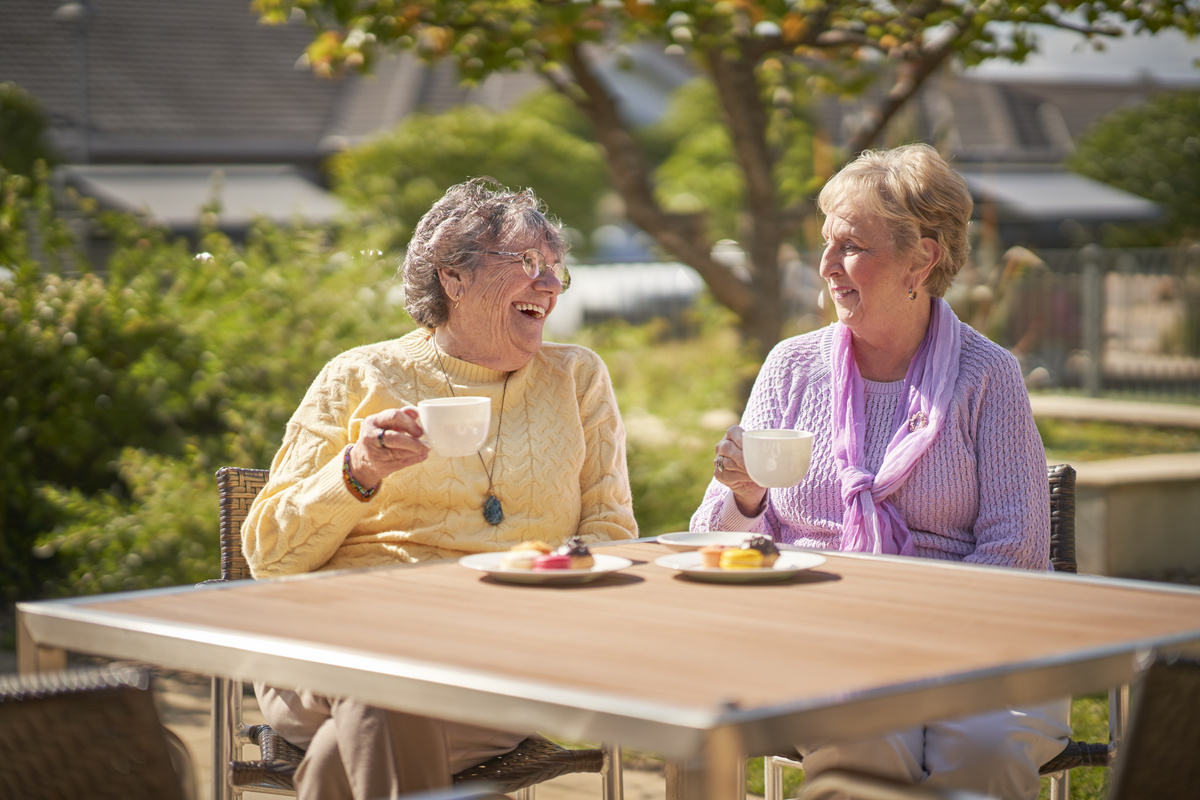Rochford Place residents having morning tea on the outdoor entertainment area in the garden