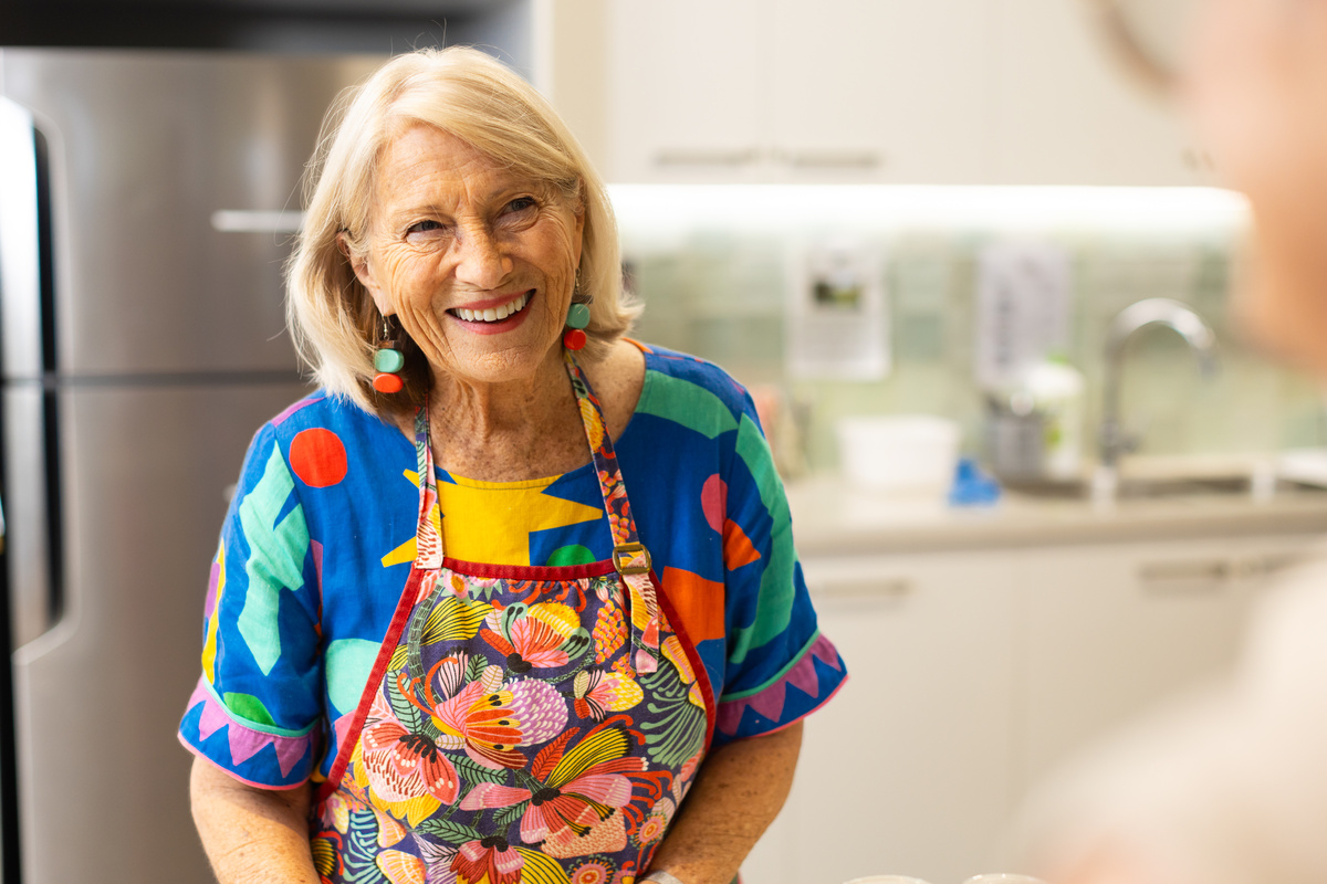 Buderim Gardens resident Susan in a colourful apron at the Rumours Café