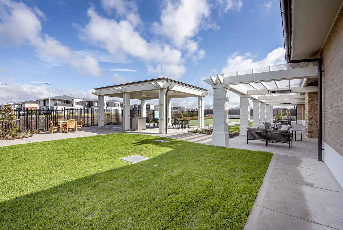 Sherwin Rise covered alfresco community area with barbecue