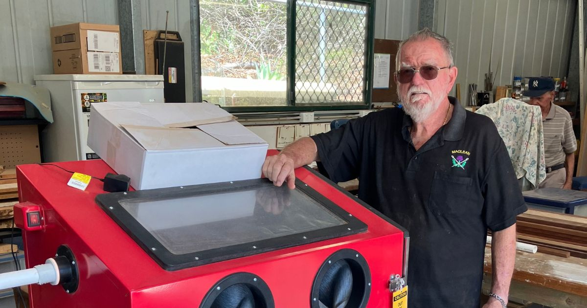 Ken uses the sand blaster to refurbish the cast iron bench chair ends around the village 