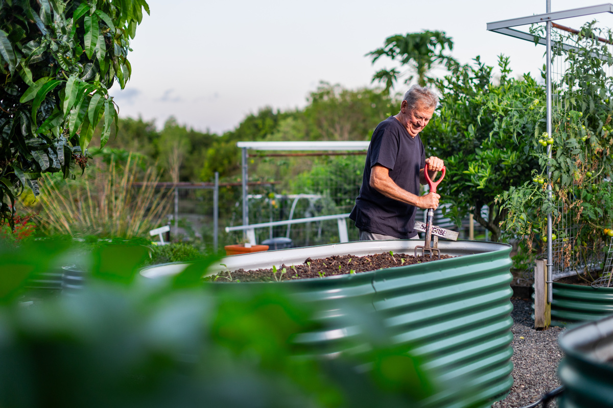 Bellflower retirement village resident David working in the village's community garden