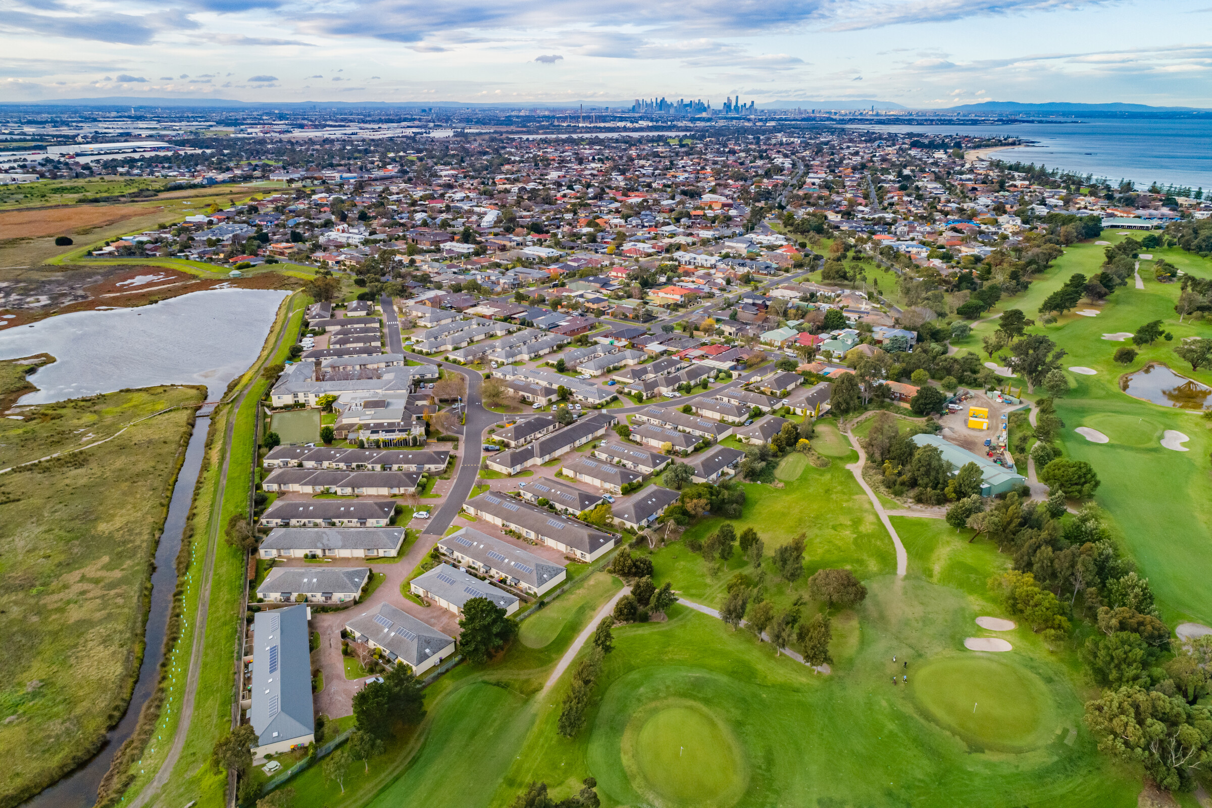 Port Phillip Village aerial image of main building, parking and nearby wetlands and coastline