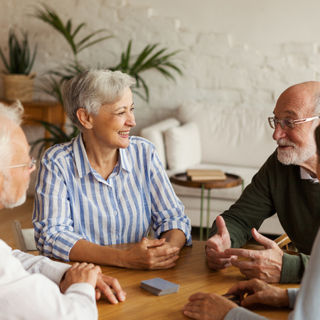 Four retirement village residents sitting around 