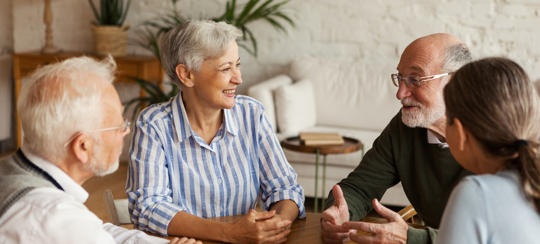 Four retirement village residents sitting around 