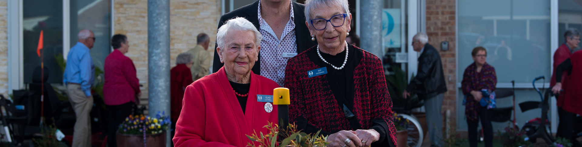 Keyton CEO Nathan Cockerill and 2 Abervale residents planting a tree for the 40 year anniversary of the village