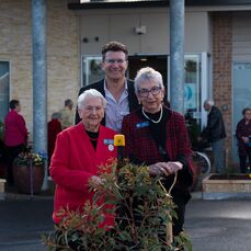 Keyton CEO Nathan Cockerill and 2 Abervale residents planting a tree for the 40 year anniversary of the village