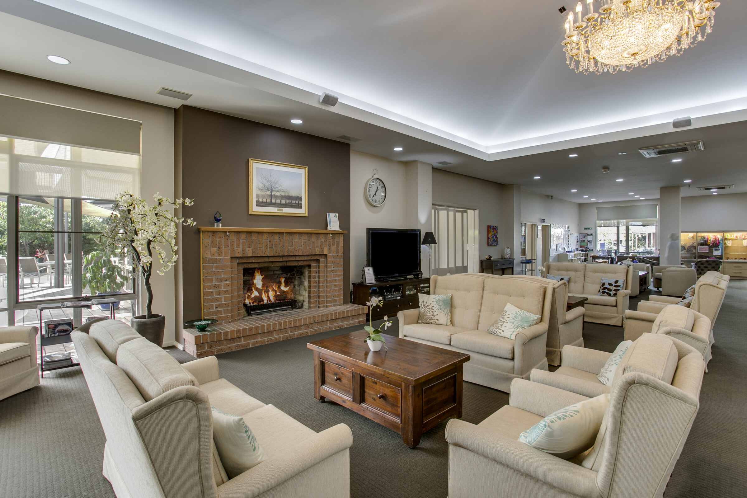 Highvale Village comfortable lounge area with fireplace