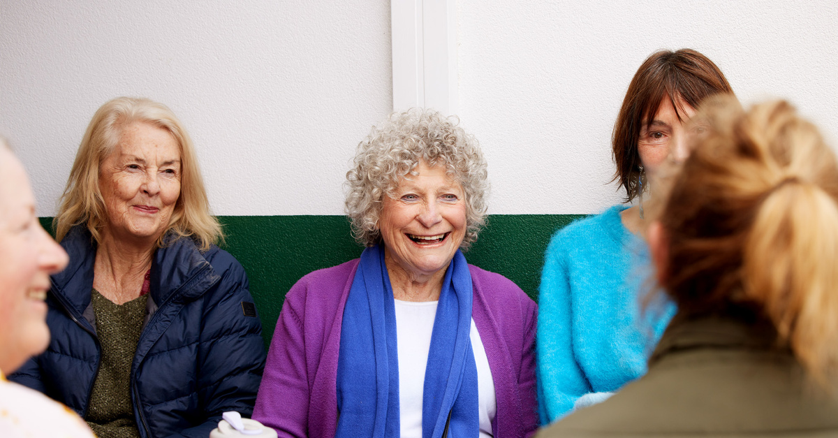 Martha's Point tree lined road amongst well maintained gardens and lawns