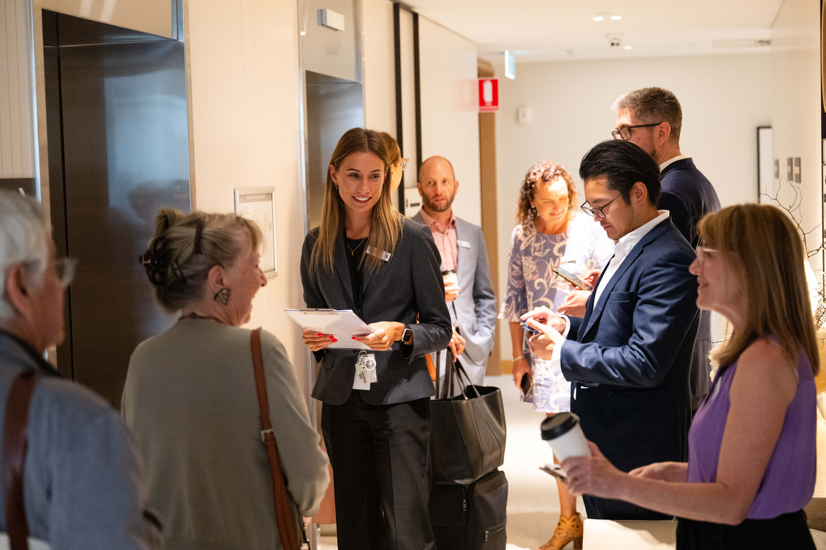 Jamieson speaking to a group of visitors at the Grand Opening of Ardency Kennedy Place