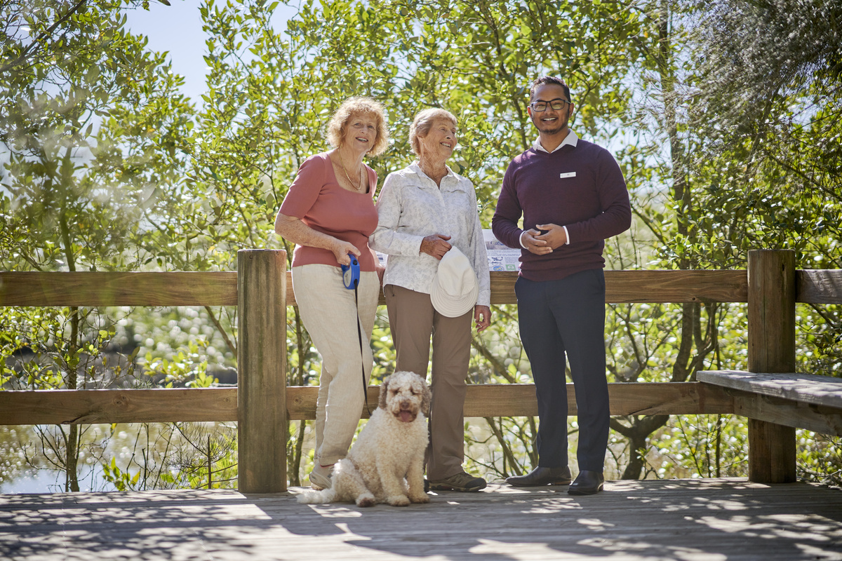 Village manager Al Noman with residents at Lakeside Retirement Village