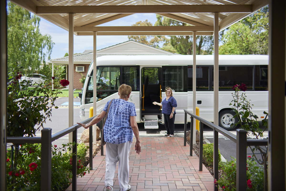 Highvale Village resident walking to village bus