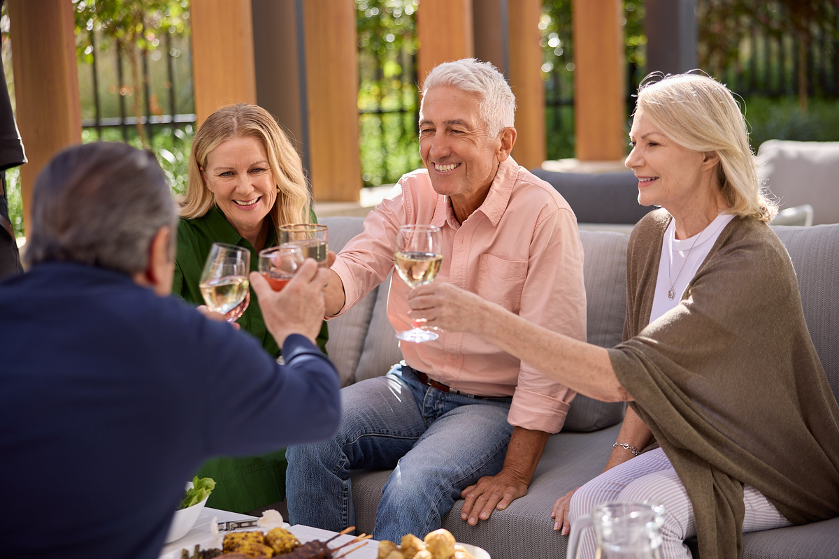 A group of seniors sitting together and drinking