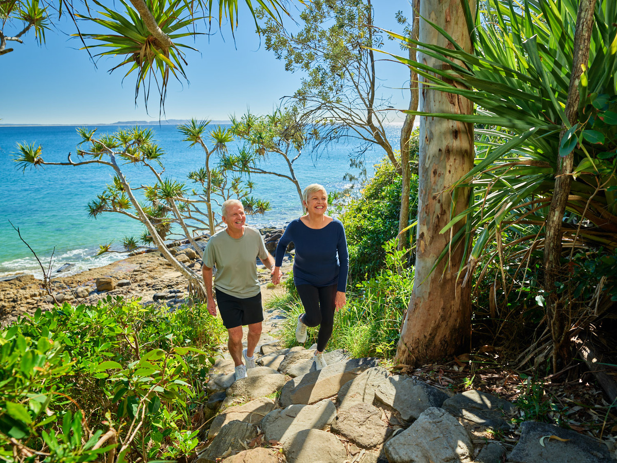 A couple walking along a reserve