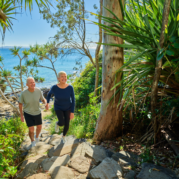 Couple walking up the stairs at Noosa National Park