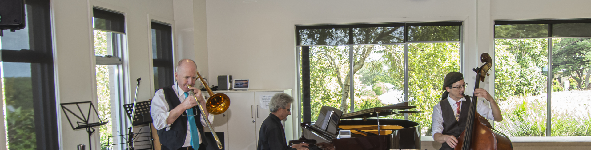 A group of musicians performing in the community hall at the Coastal Waters retirement village