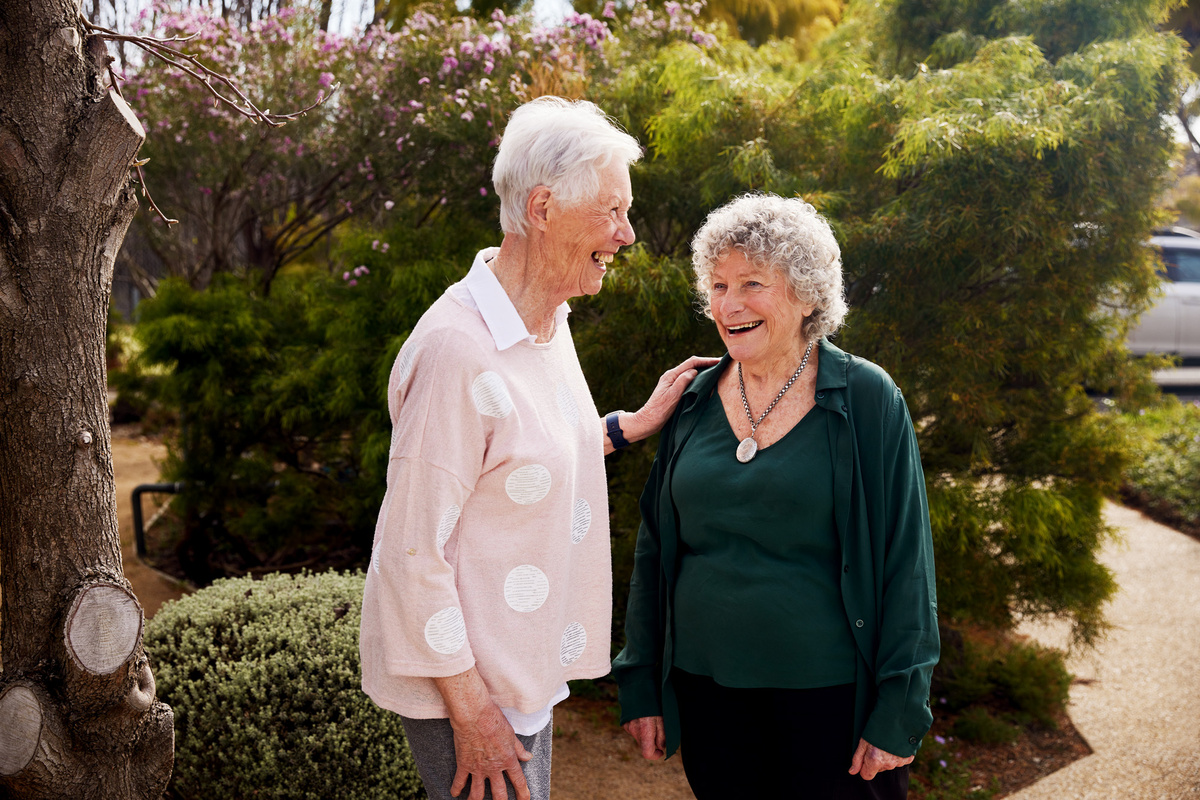 Two ladies laughing together