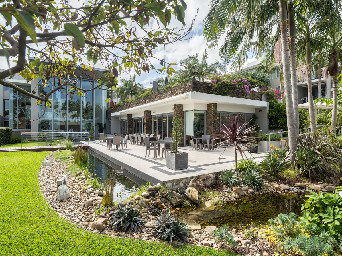 The common area at the Baytree is surrounded by greenery