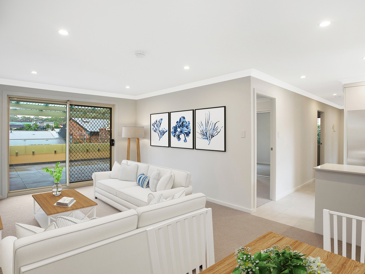 A well designed living room with white and blue interiors