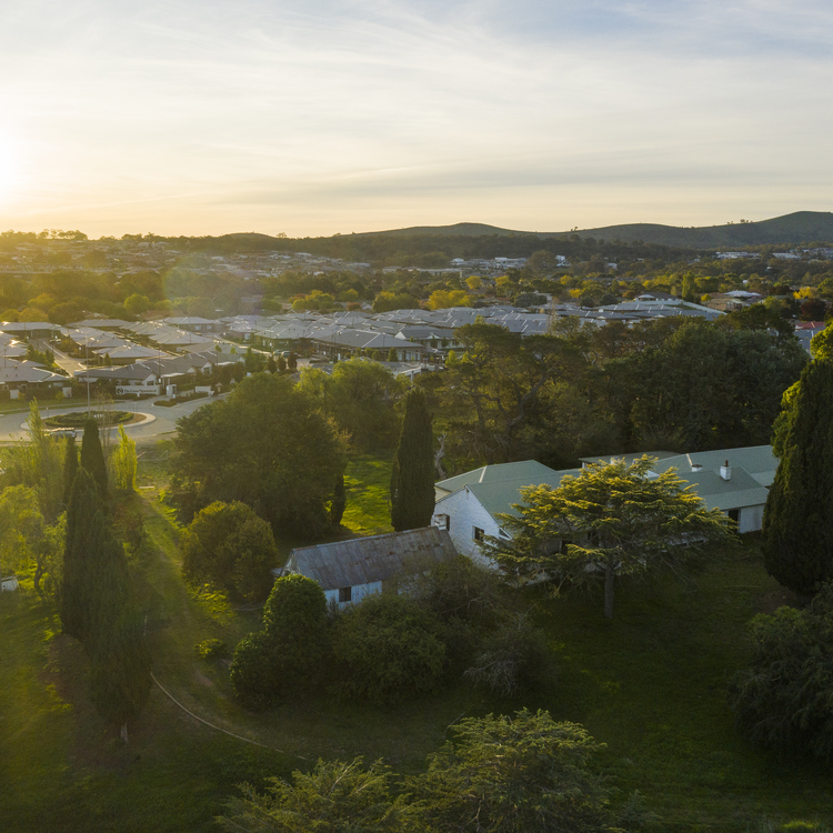 Gold Creek aerial image of village buildings with district and hills in the distance
