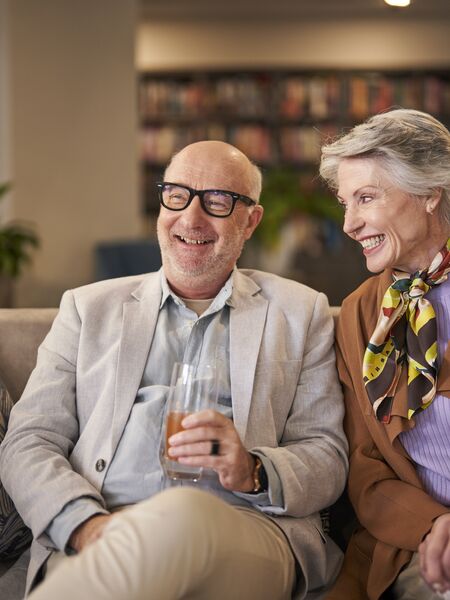 Older couple sitting in Ardency library