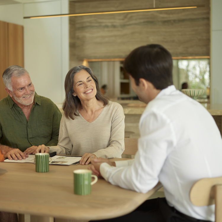 Couple discusses ownership with an Ardency staff member