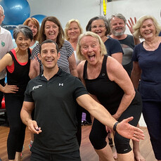 Smiling members of the Community Moves over 50s gym health and fitness community for seniors.
