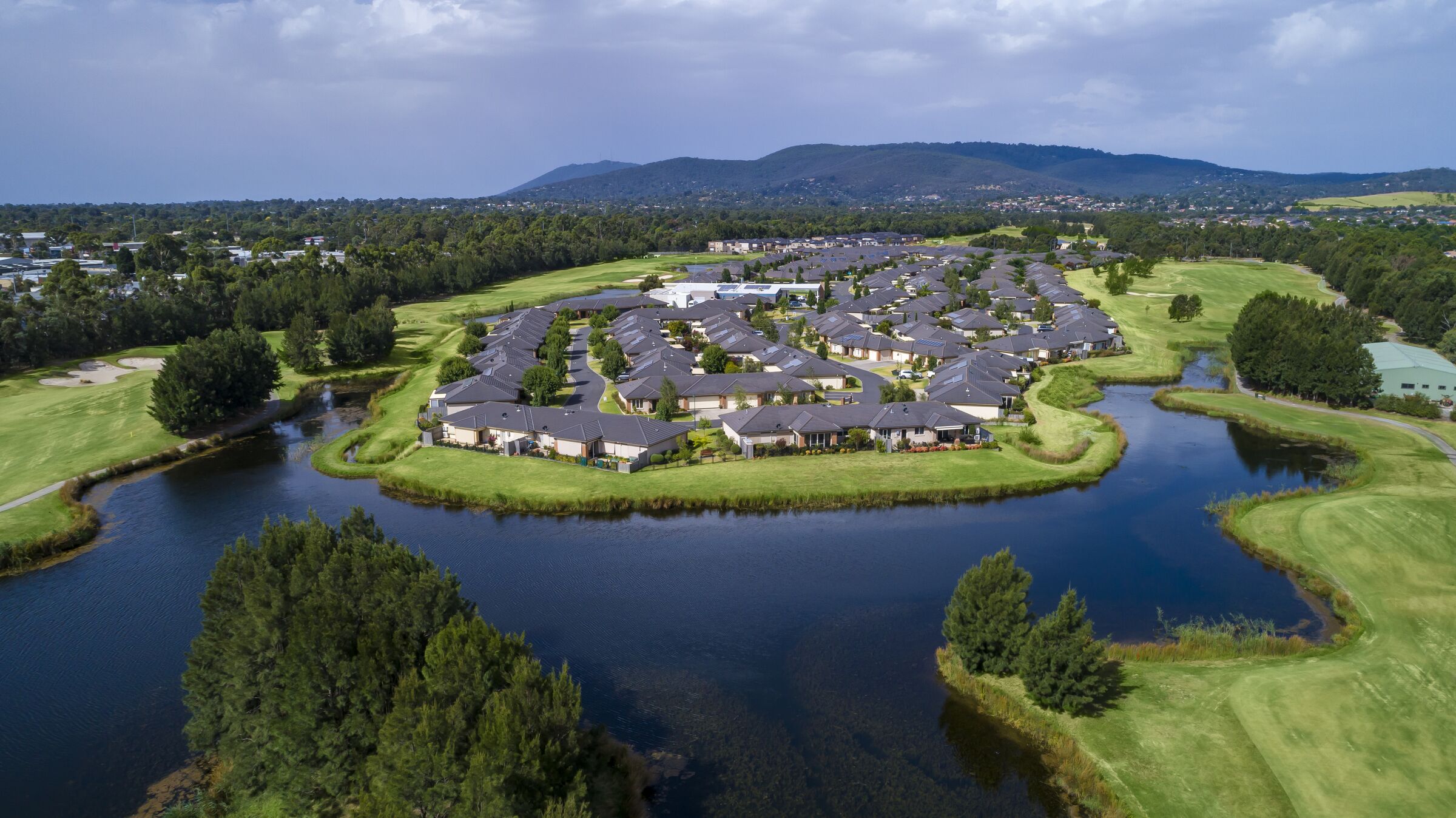 Waterford Park aerial image of site and surrounding district including golf course, lake and hills