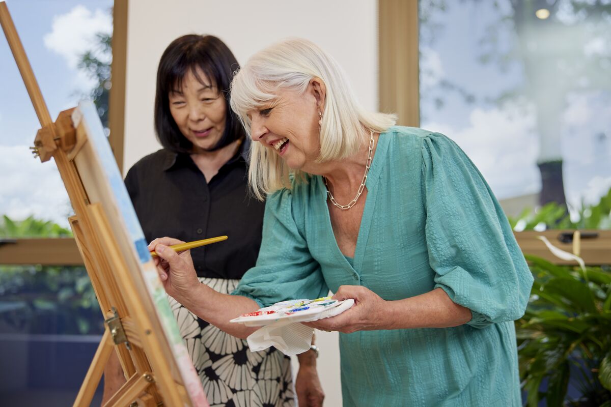 Two residents making a painting