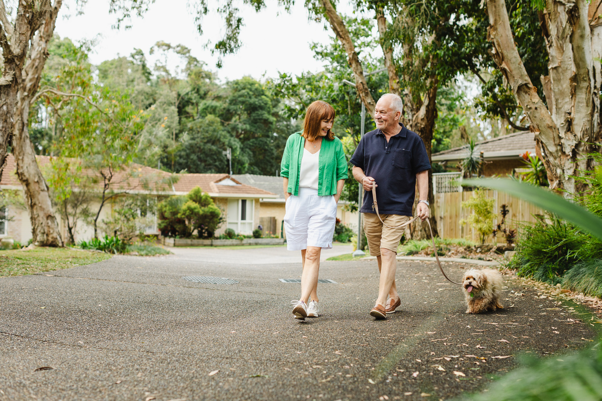A couple walking their dog