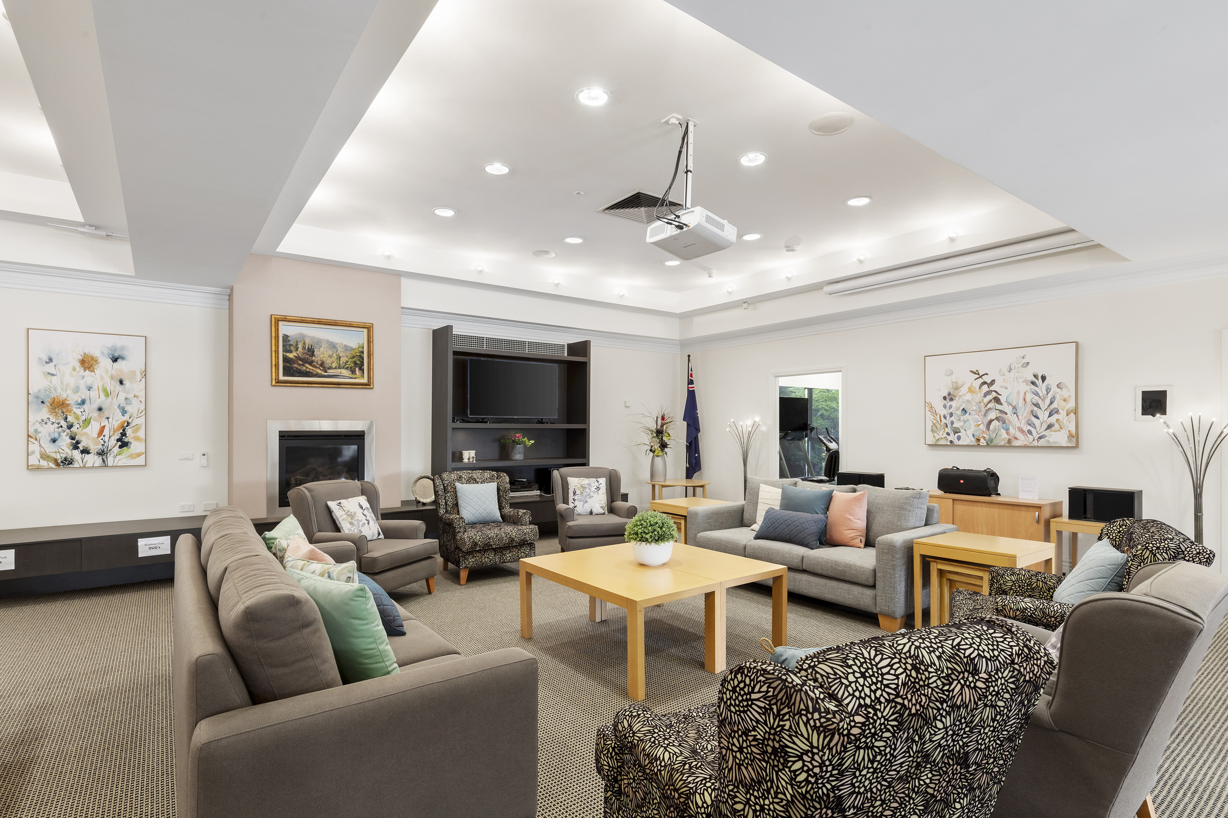 Windsor Park spacious lounge area with seating, fireplace and television