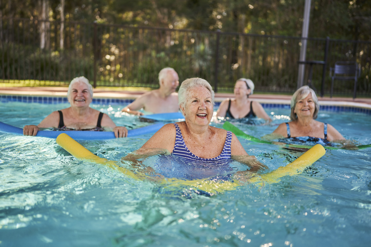Residents doing aqua aerobics in a swimming pool