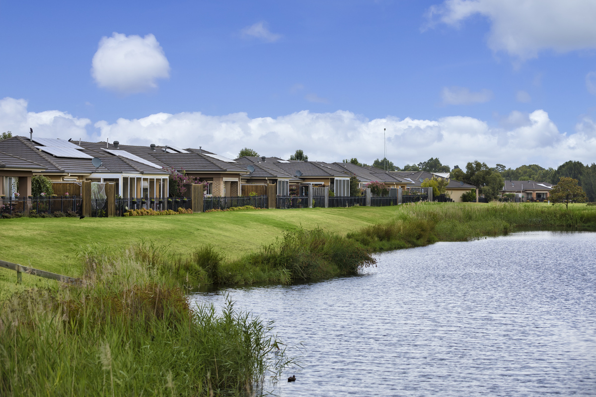 Waterford Park looking towards village buildings over nearby golf lake