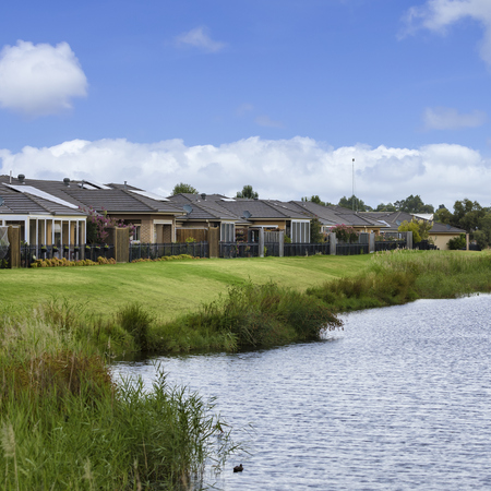 Waterford Park looking towards village buildings over nearby golf lake