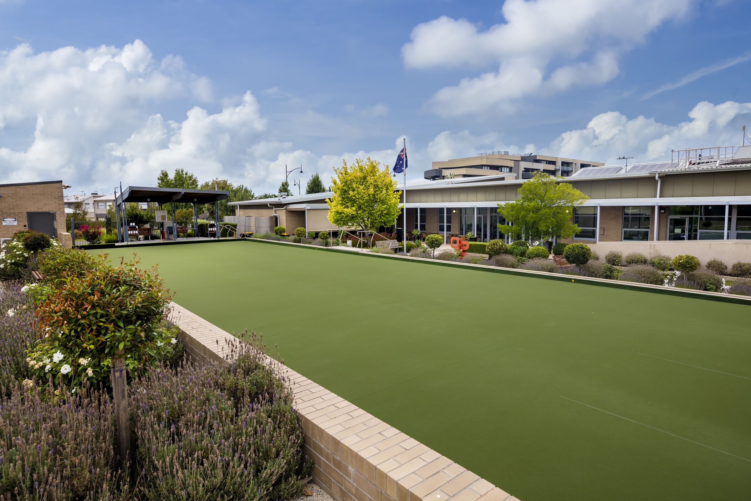 Caesia Gardens bowling green with shade next to main building